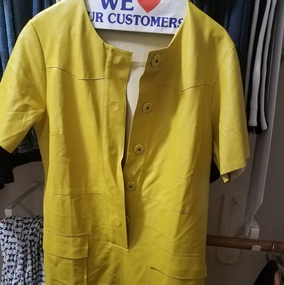 A bright yellow faux leather dress